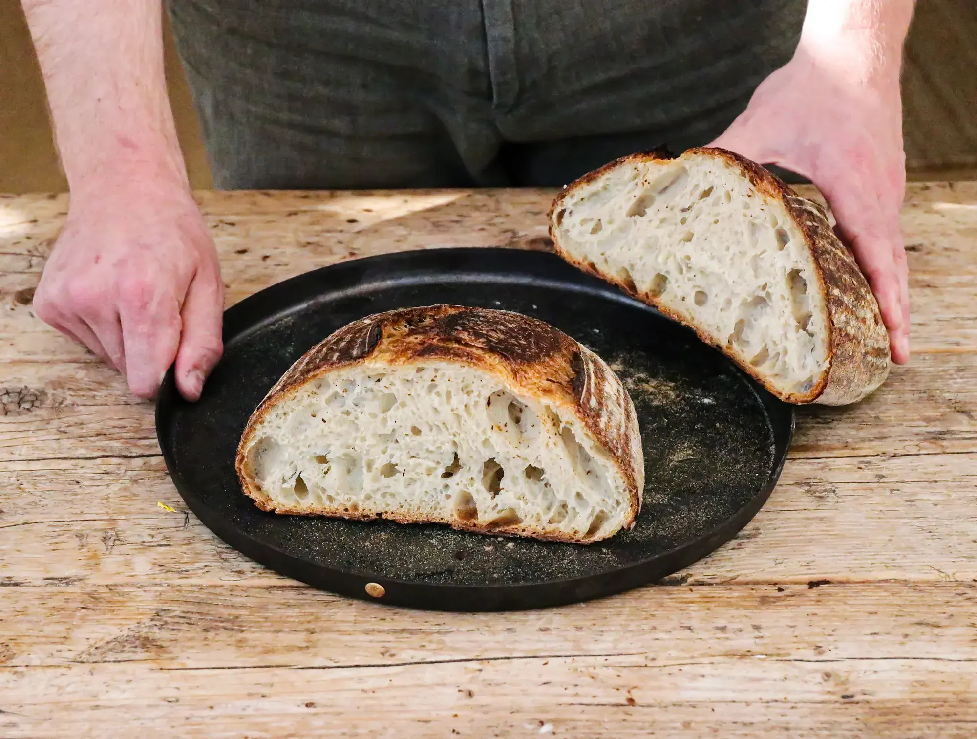 A sliced sourdough loaf on a plate