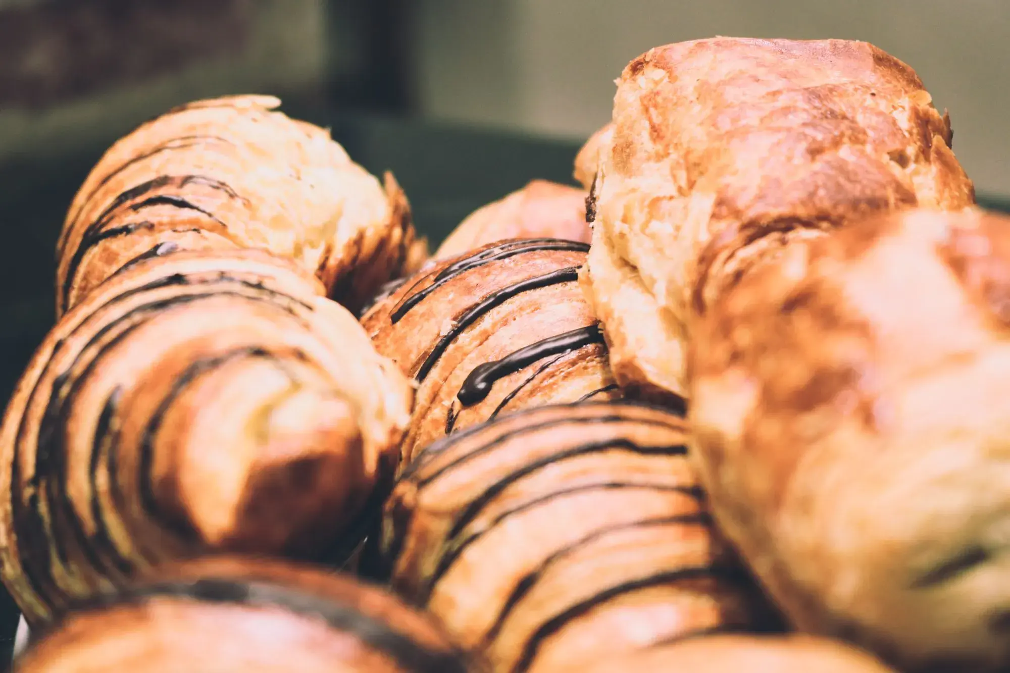 Croissants and pastries drizzled with chocolate